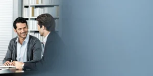 Business owner meeting with a financial planner in a bright professional office