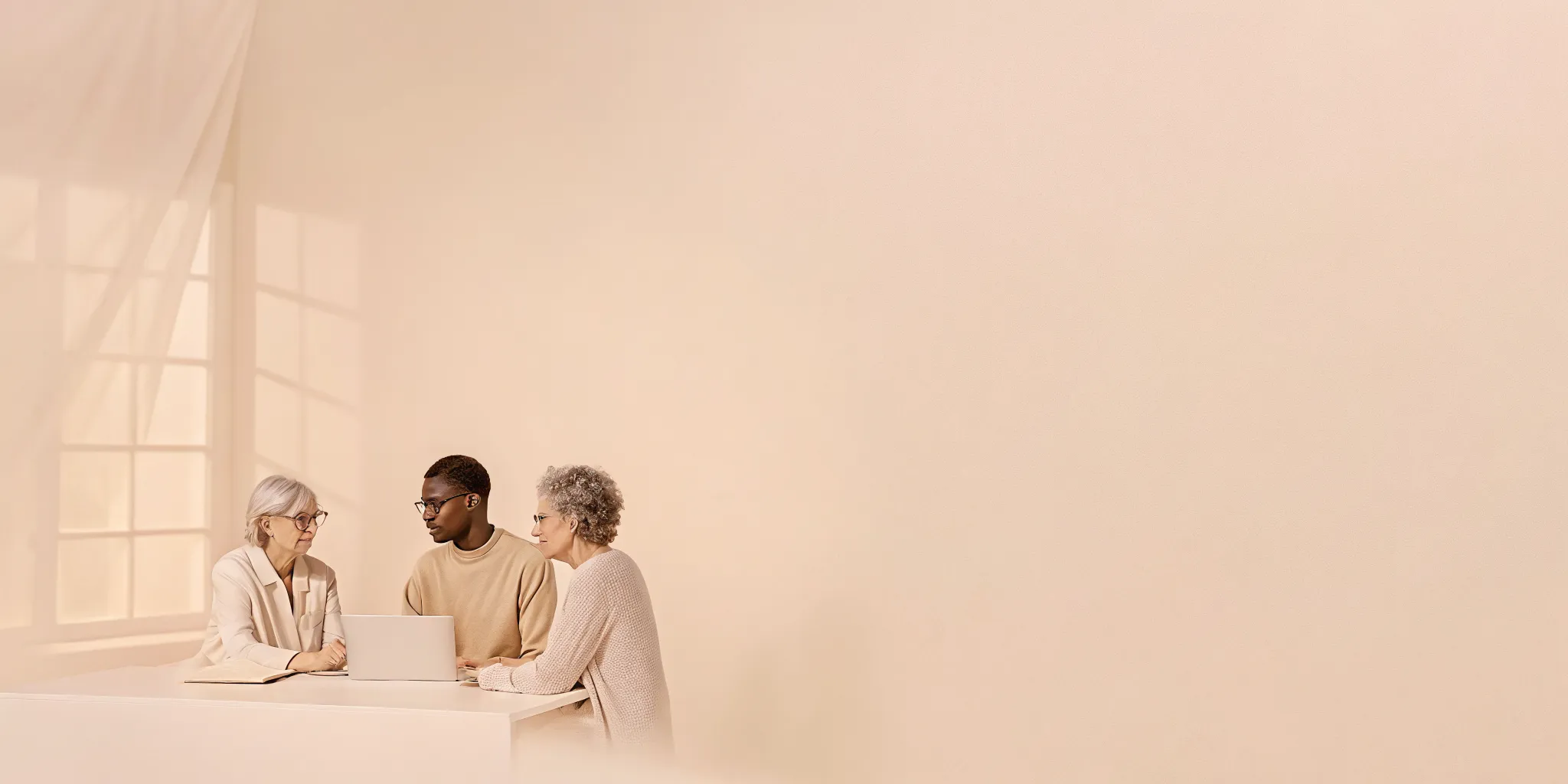 Wealth planner speaking with a couple in their fifties in a bright home office about healthcare savings and retirement